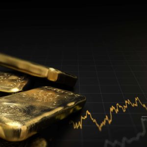 Finanztsunami - Goldbarren auf schwarzem Hinterggrund